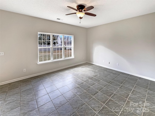 unfurnished room with baseboards, a textured ceiling, visible vents, and a ceiling fan