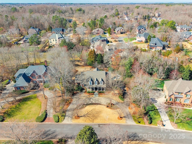 birds eye view of property with a residential view