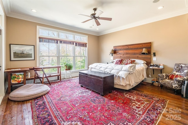 bedroom featuring recessed lighting, ornamental molding, and wood finished floors