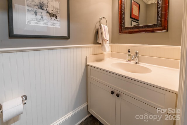 bathroom with vanity and wainscoting