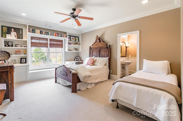 bedroom featuring recessed lighting, ceiling fan, ornamental molding, light colored carpet, and connected bathroom