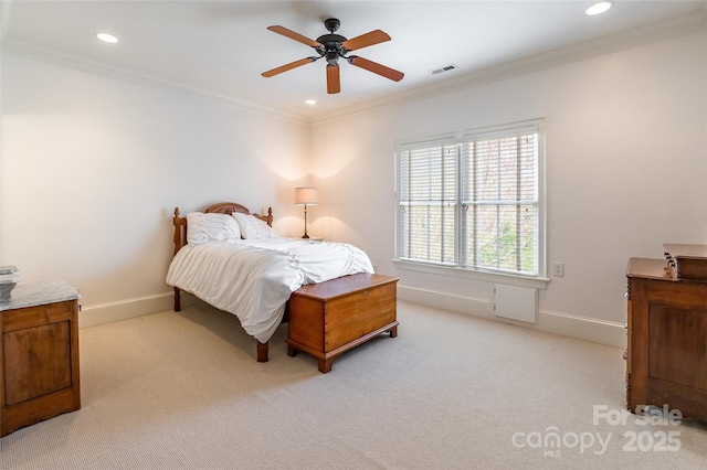 bedroom featuring visible vents, light carpet, and crown molding