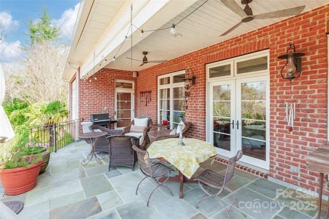 view of patio with french doors and ceiling fan