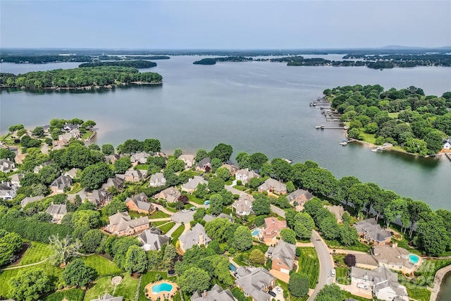 birds eye view of property with a residential view and a water view