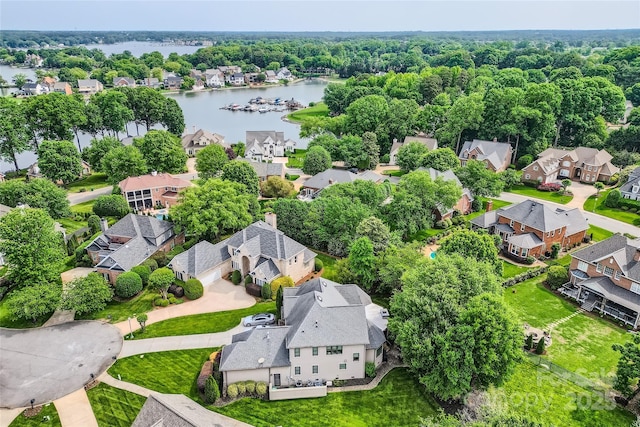 bird's eye view featuring a water view and a residential view