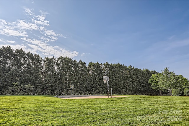 view of yard with community basketball court