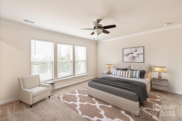 bedroom featuring carpet floors, crown molding, visible vents, ceiling fan, and baseboards