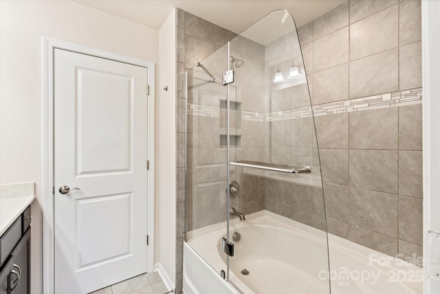 full bath with tile patterned floors, enclosed tub / shower combo, and vanity