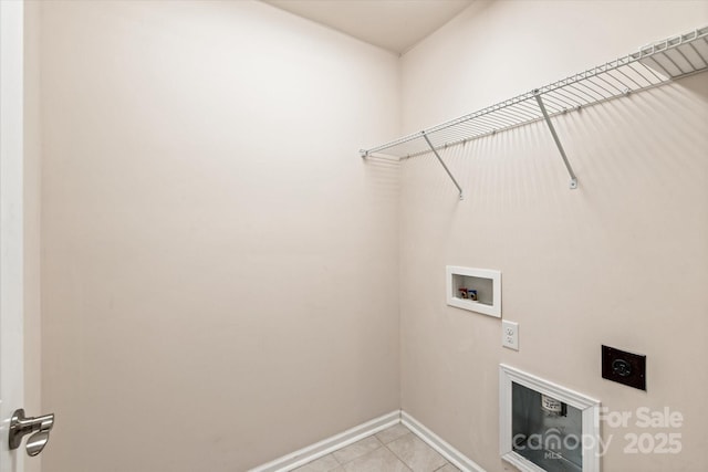 laundry room with washer hookup, hookup for an electric dryer, light tile patterned flooring, laundry area, and baseboards