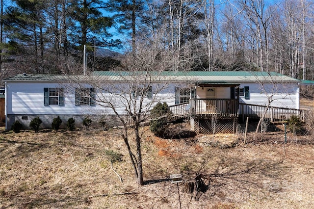 exterior space with metal roof and crawl space