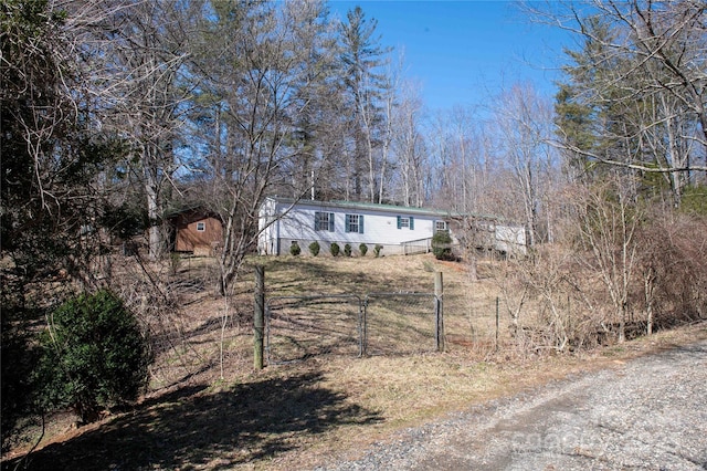 view of front of home with a gate and fence