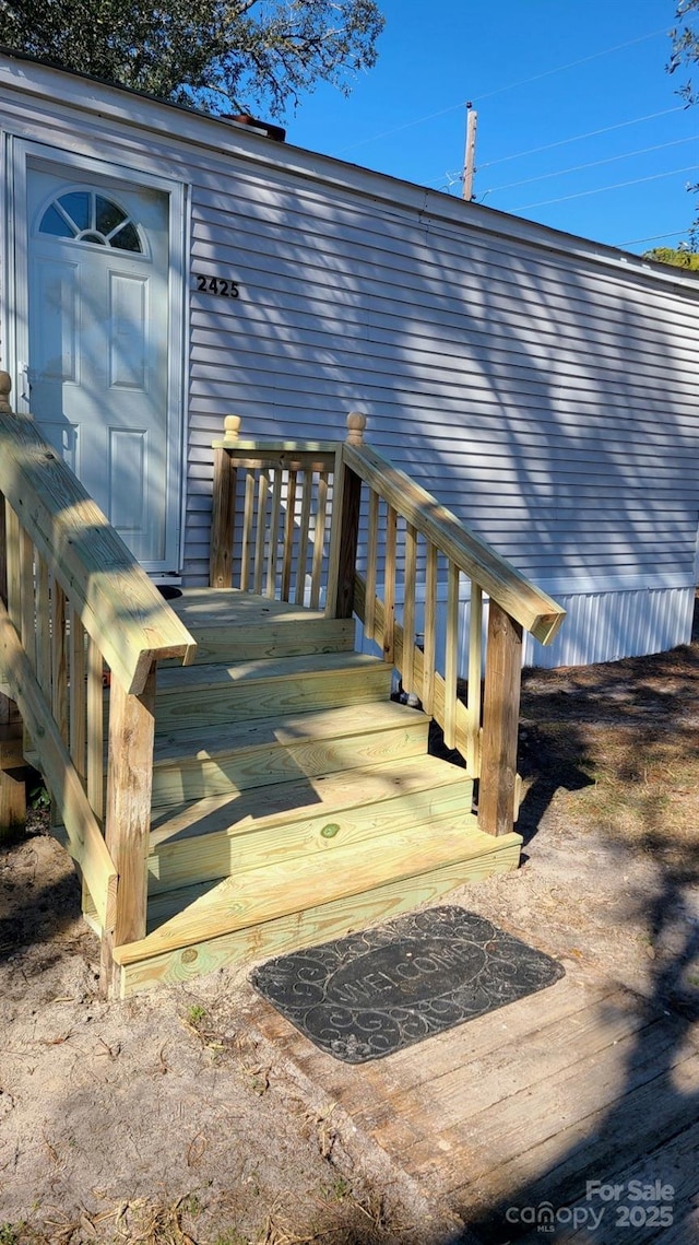 exterior space with a carport and a deck