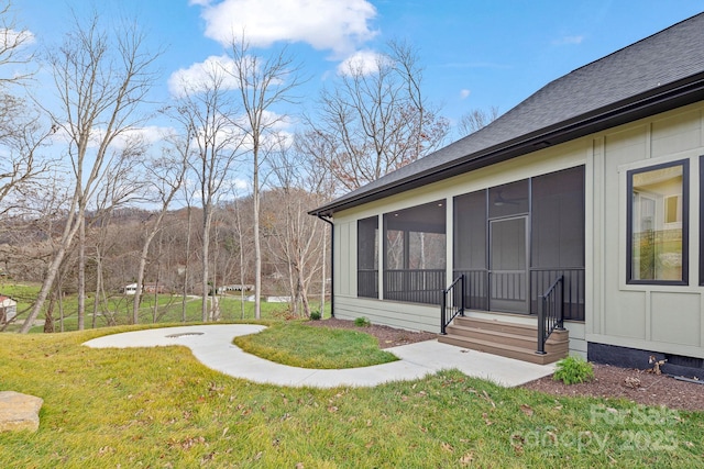 view of yard with a sunroom