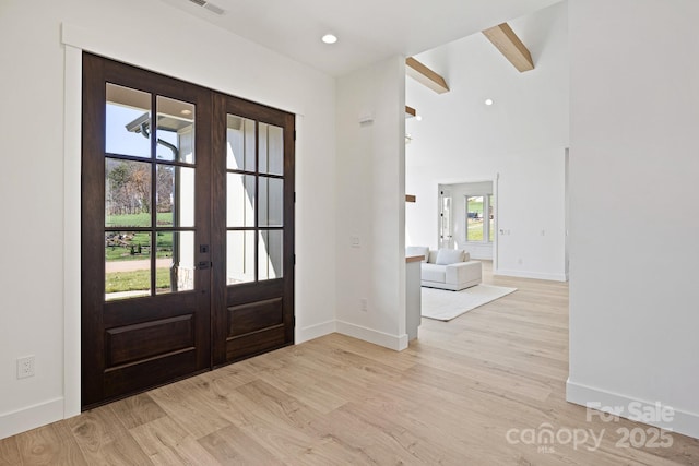 entrance foyer featuring recessed lighting, baseboards, wood finished floors, and french doors