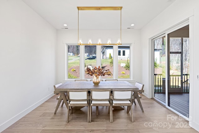 dining room featuring light wood-style floors, baseboards, breakfast area, and recessed lighting