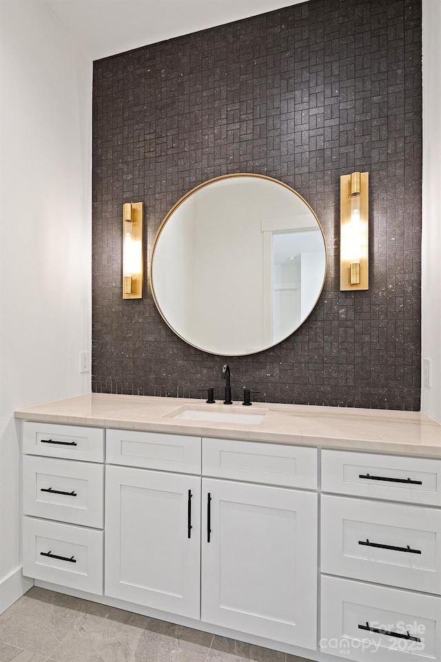 bathroom featuring tasteful backsplash and vanity