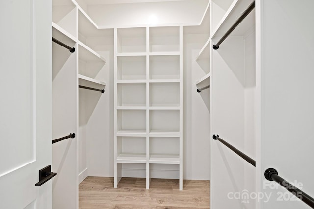 spacious closet with light wood-style flooring