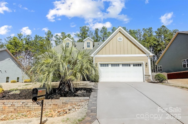 view of front facade featuring a garage, concrete driveway, and board and batten siding