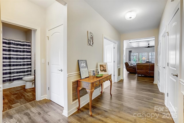 hall featuring wood finished floors