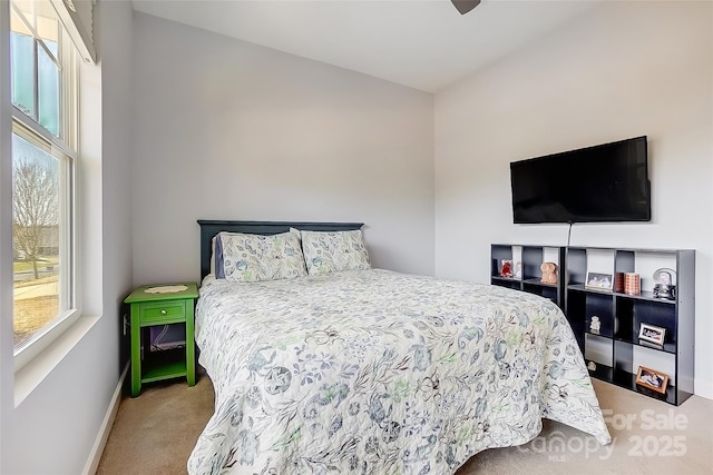 bedroom featuring carpet floors, ceiling fan, and baseboards