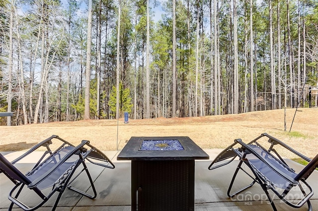 view of patio featuring a fire pit