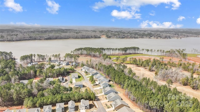 bird's eye view featuring a water view and a residential view