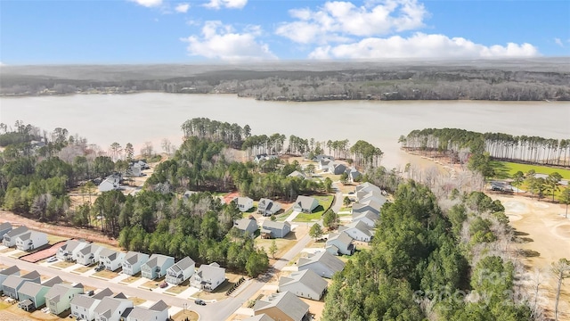 drone / aerial view with a residential view and a water view