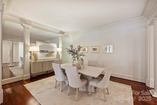 dining space with a baseboard radiator, dark wood-type flooring, baseboards, ornate columns, and crown molding