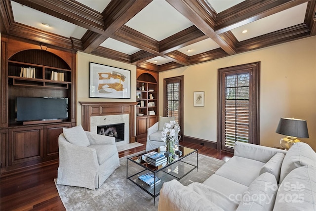 living room with dark wood-style flooring, beamed ceiling, and a high end fireplace