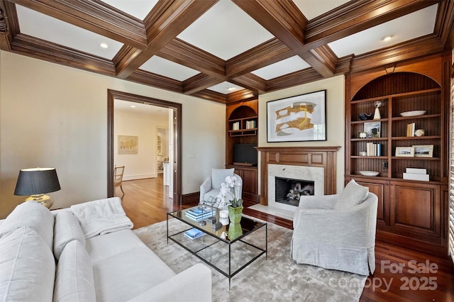 living room featuring coffered ceiling, wood finished floors, and beam ceiling