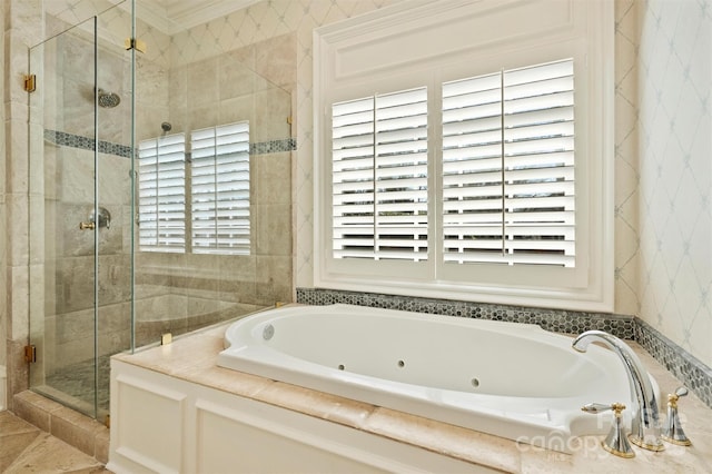 bathroom with ornamental molding, a stall shower, a jetted tub, and a wealth of natural light