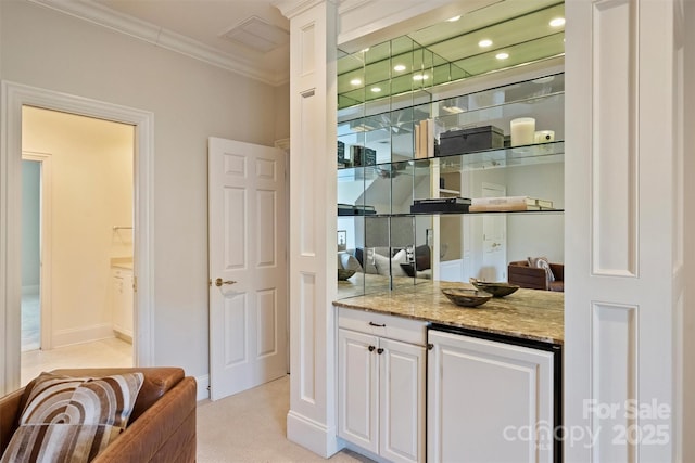 bar featuring recessed lighting, light carpet, crown molding, and baseboards