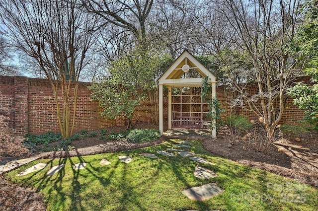 view of outbuilding with fence