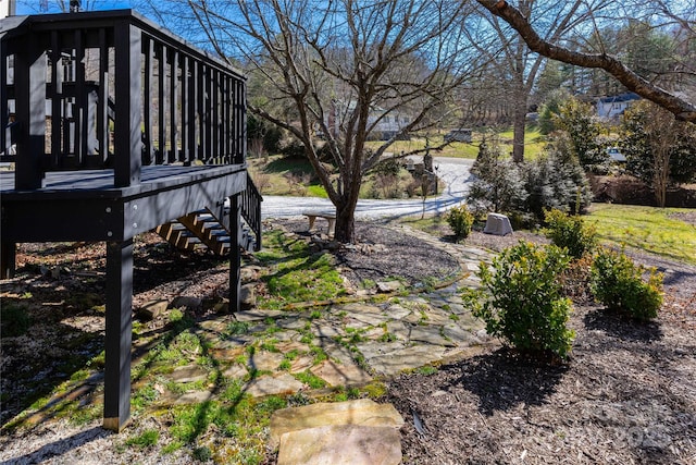 view of yard with stairway and a wooden deck