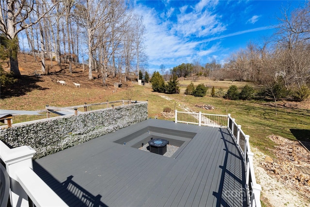 wooden deck featuring a jacuzzi