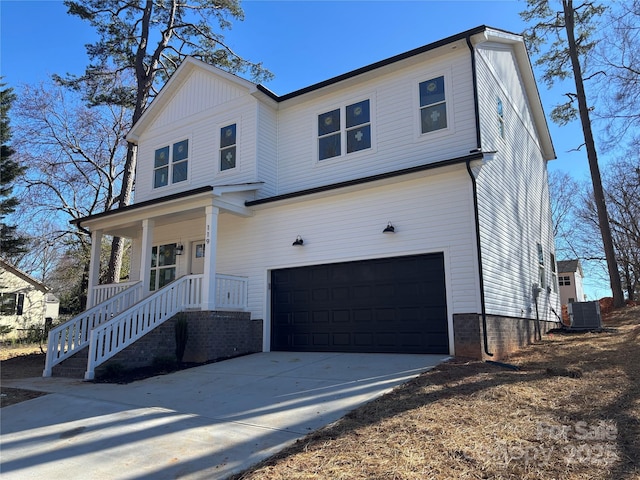 view of front facade featuring a garage, concrete driveway, a porch, and cooling unit