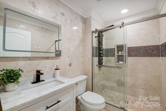 bathroom with toilet, a shower stall, ornamental molding, and vanity