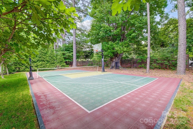 view of sport court featuring community basketball court, a lawn, and fence