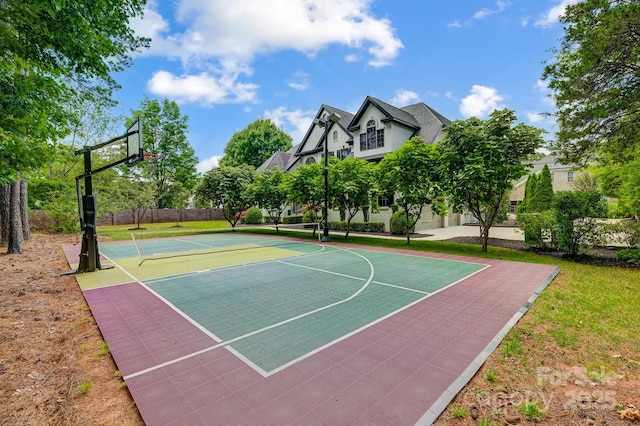 view of basketball court featuring community basketball court and fence