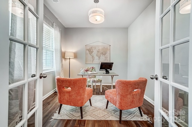 office area with french doors, wood finished floors, and baseboards