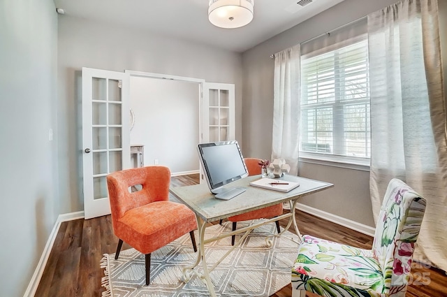 office with wood finished floors and baseboards