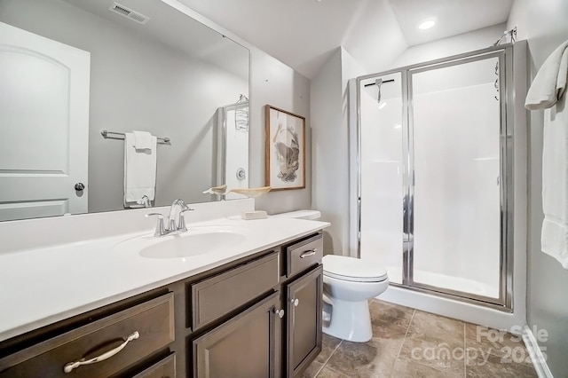 full bath featuring toilet, a stall shower, vanity, and visible vents