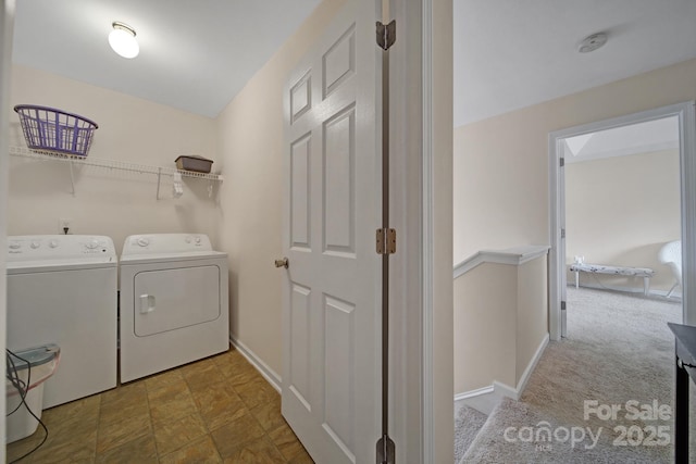 laundry room featuring laundry area, baseboards, washer and clothes dryer, and carpet flooring