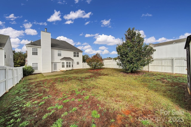 view of yard with a fenced backyard