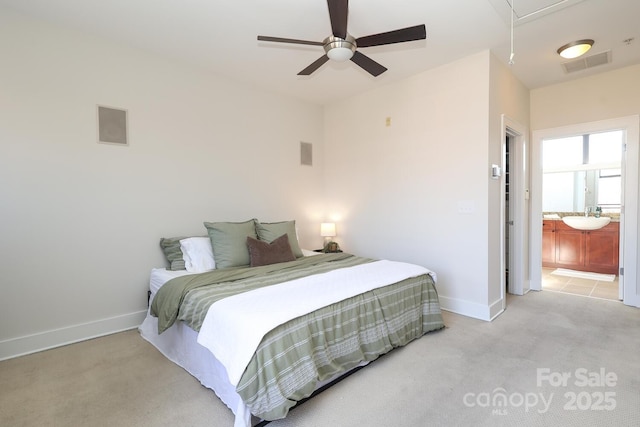 bedroom with baseboards, visible vents, attic access, and light colored carpet