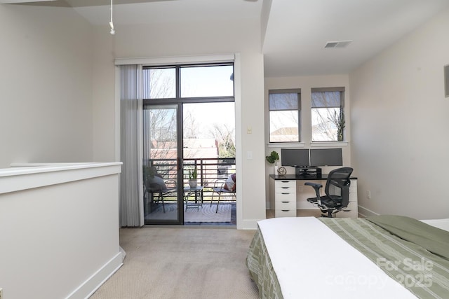 bedroom featuring access to exterior, visible vents, light carpet, and baseboards