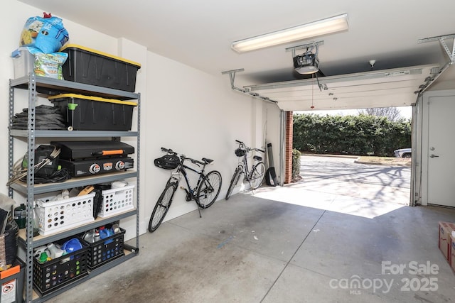 garage featuring a garage door opener