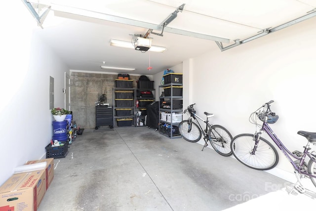 garage featuring a garage door opener and electric panel