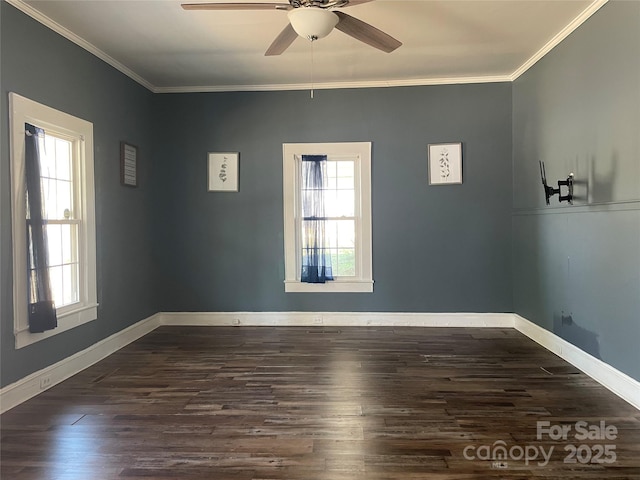 empty room with dark wood-style floors, crown molding, baseboards, and a ceiling fan