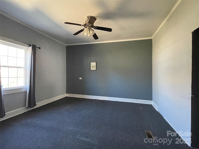 unfurnished room featuring baseboards, a ceiling fan, and crown molding